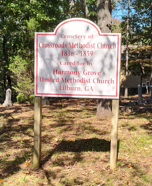 Sign that reads, "Cemetery of Crossroads Methodist Church, 1836-1859. Cared for by Harmony Grove United Methodist Church, Lilburn, GA".
